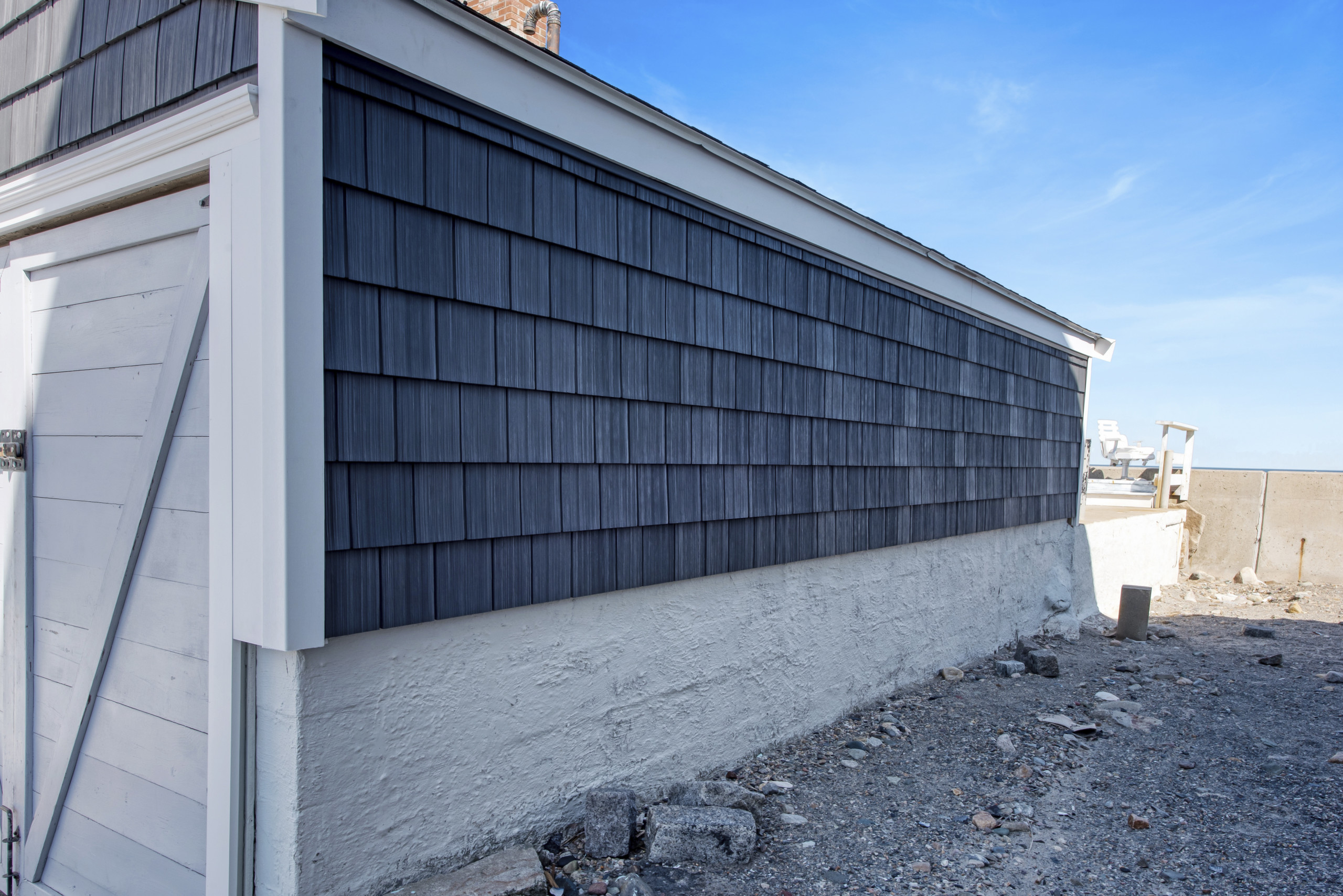 New Black siding on a house from Coastal Windows and Exteriors