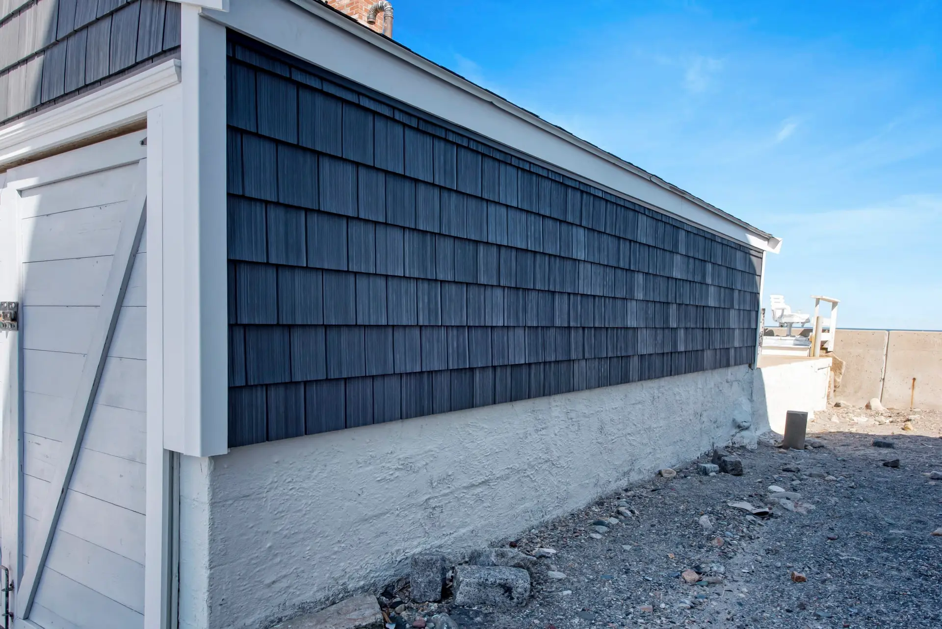 New Black siding on a house from Coastal Windows and Exteriors