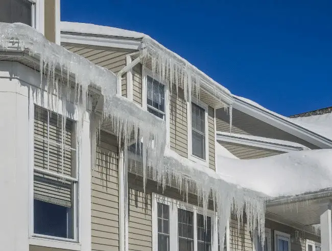 February home maintenance checklist by Coastal Windows & Exteriors for homeowners in Massachusetts & New Hampshire — winter home maintenance MA & NH, roof inspection MA, siding care MA, keep your home safe during winter.