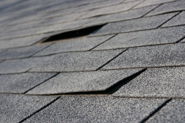 Roofing trouble - damage to shingles that needs repair - home maintenance series.
