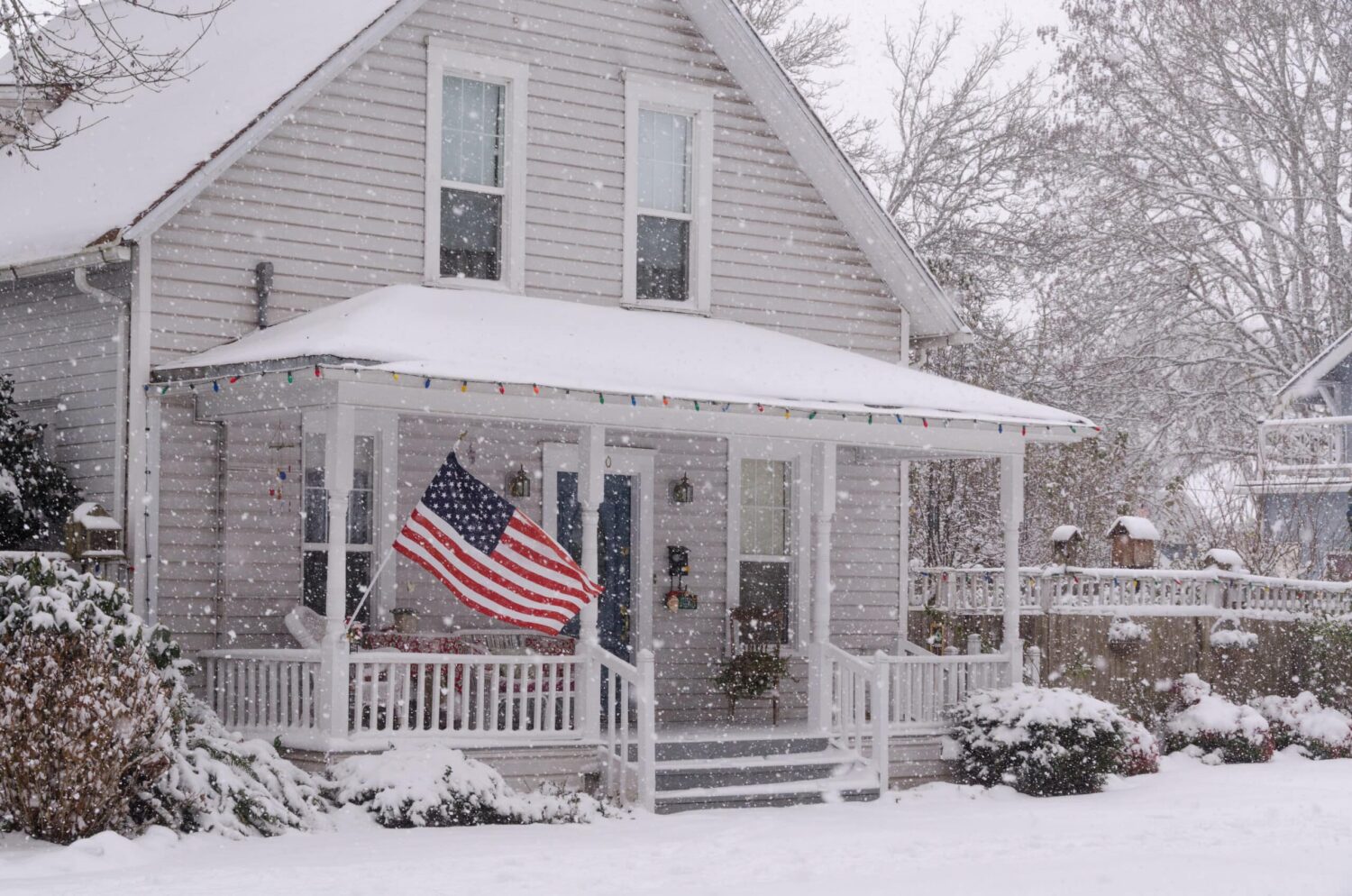 How much does snow weigh on a Middlesex County Massachusetts colonial home - properly cleared roof showing safe snow load management by GAF Master Elite contractor Coastal Windows