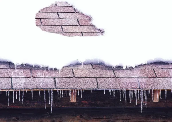 Snow load danger on roof, showing weight stresses and damage risks for roofs in New England by Coastal Windows & Exteriors