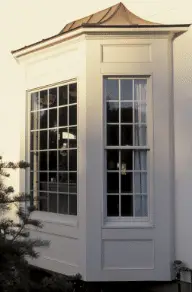 Stately fiberglass front door installation boosting curb appeal of a New England exterior remodel
