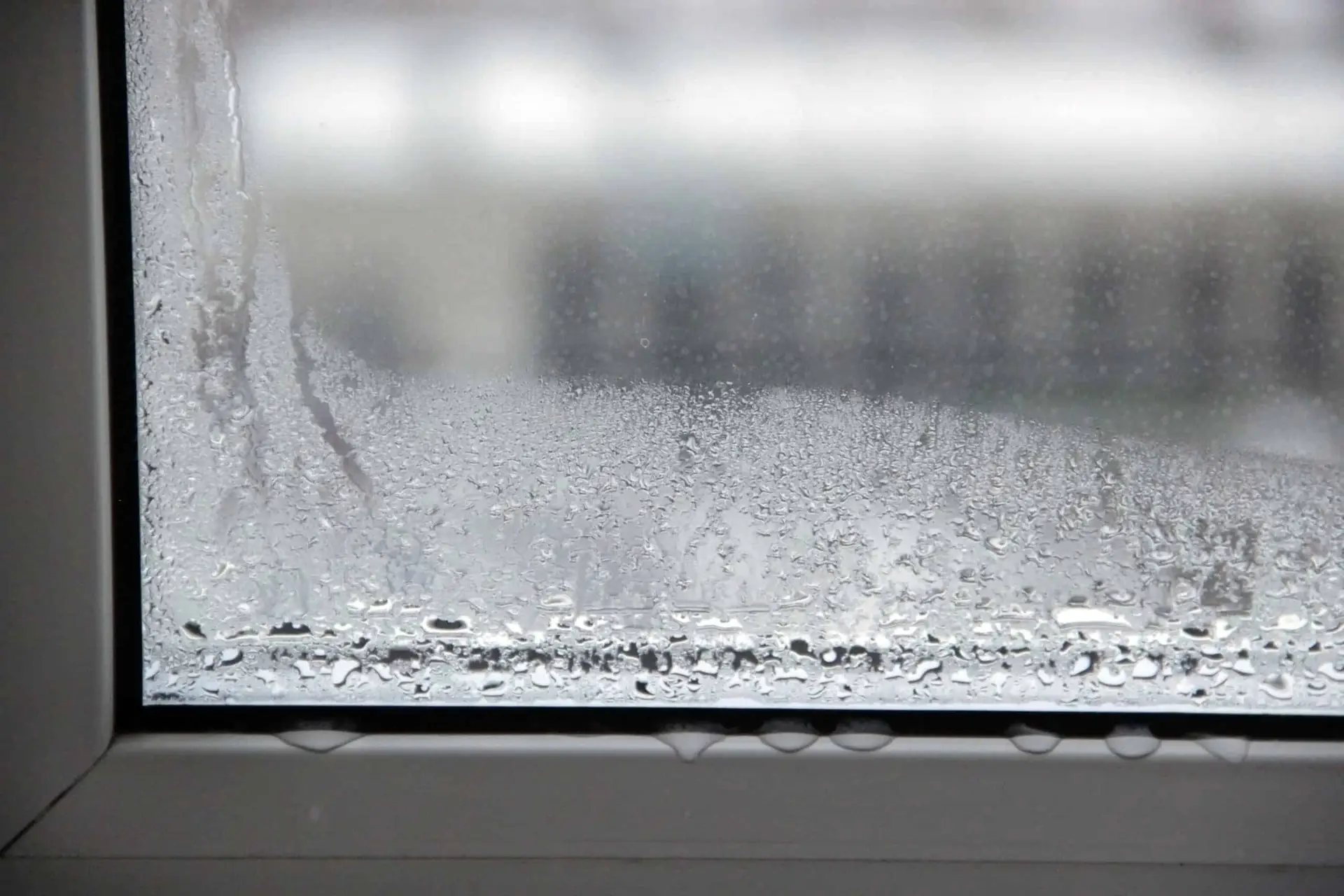 foggy window with condensation in the winter