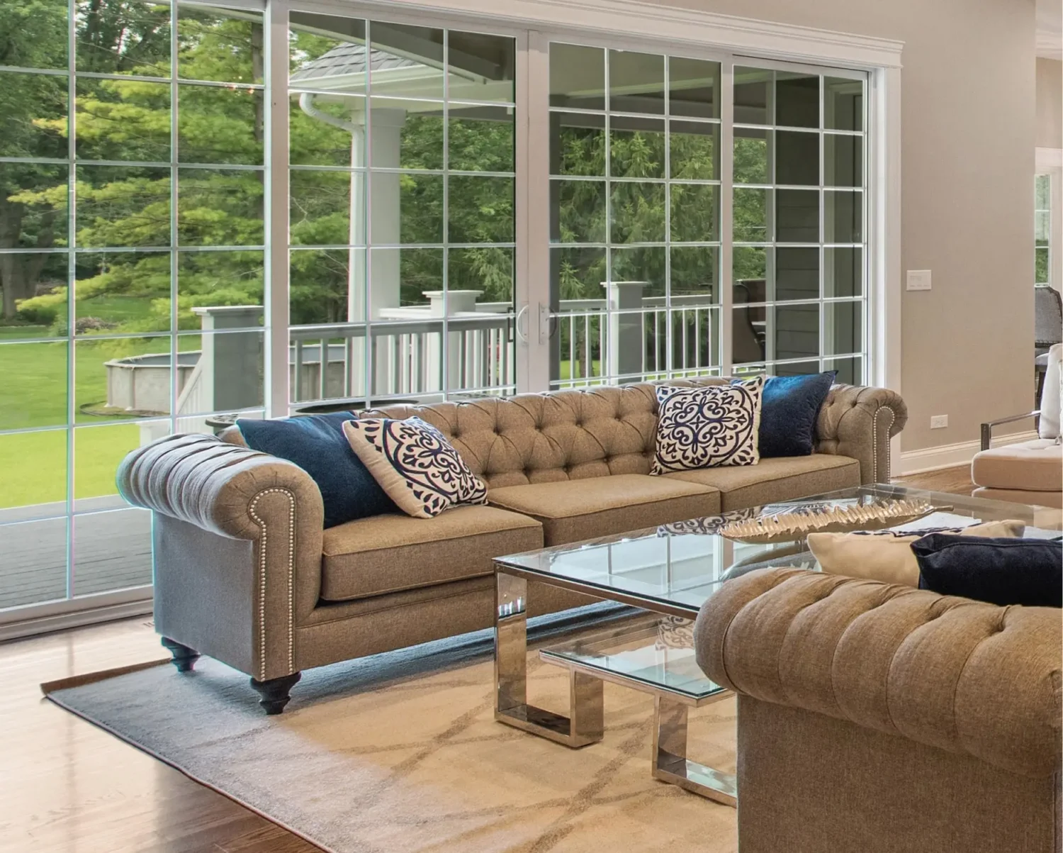 Large sliding glass doors and modern replacement windows help protect this living space from moisture intrusion and water damage. Windows are leaking water when seals, frames, or drainage systems begin to fail, making timely replacement essential for maintaining comfort and efficiency.