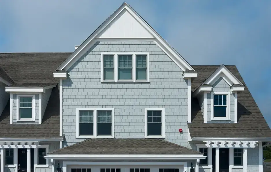 Gray shake-style insulated vinyl siding demonstrating long-lasting color and performance for homeowners asking does vinyl siding fade.