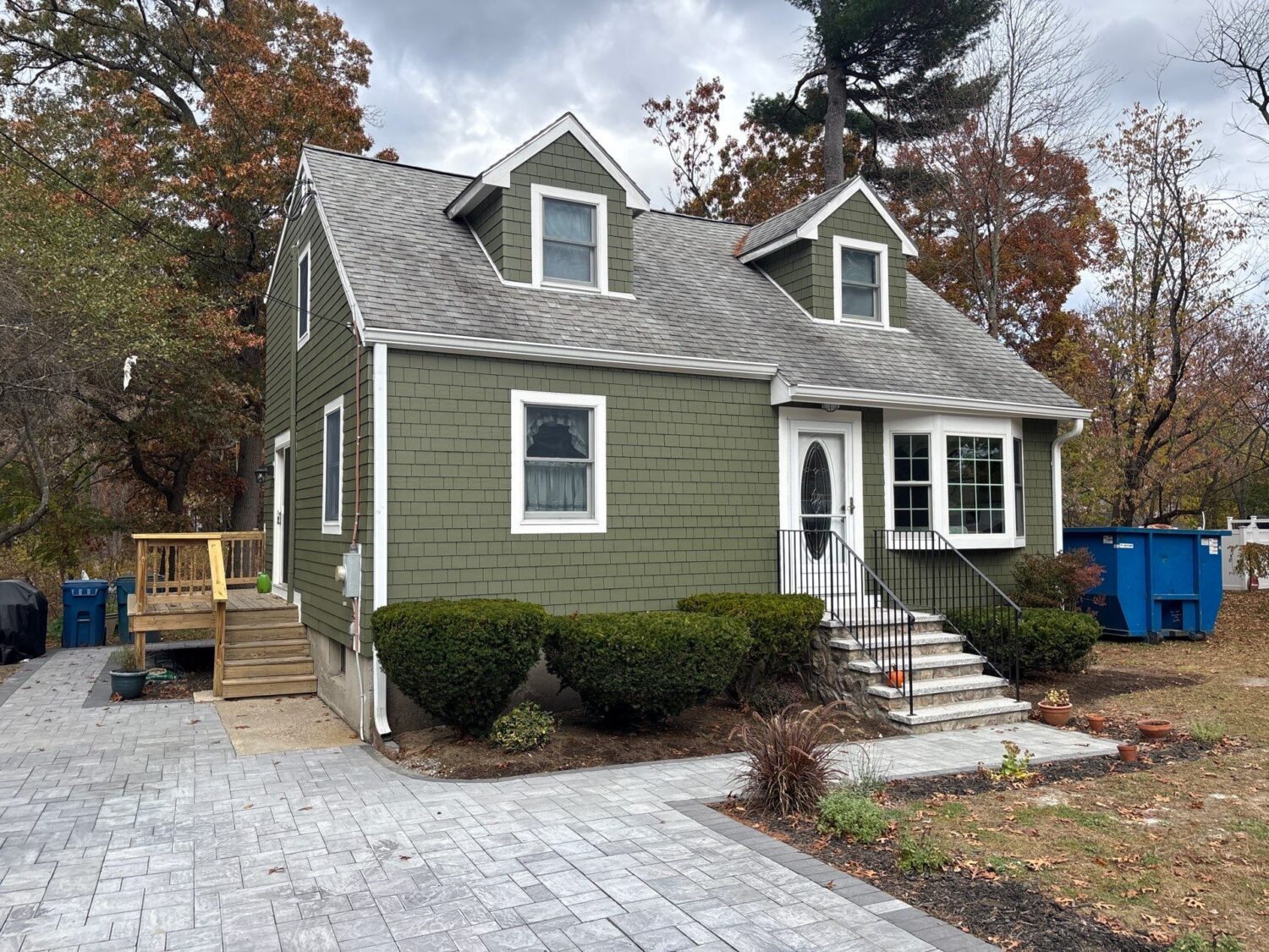 Mountain Sage James Hardie siding gives this home a natural, earthy appearance that blends beautifully with mature landscaping. Homeowners evaluating James Hardie siding colors often select green tones for their timeless charm and curb appeal.