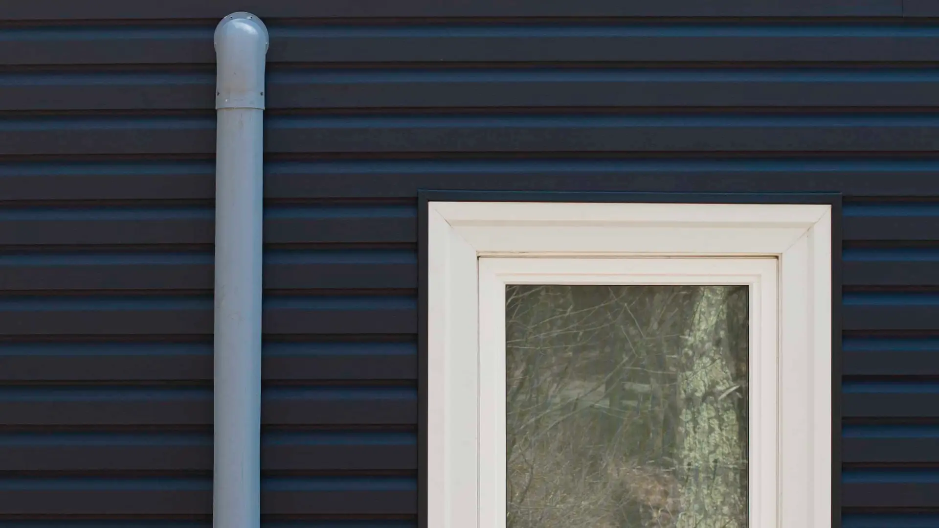 new blue siding from coastal windows on a home