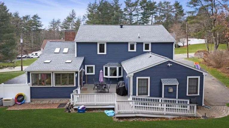 Home exterior with indigo vinyl Dutch lap siding