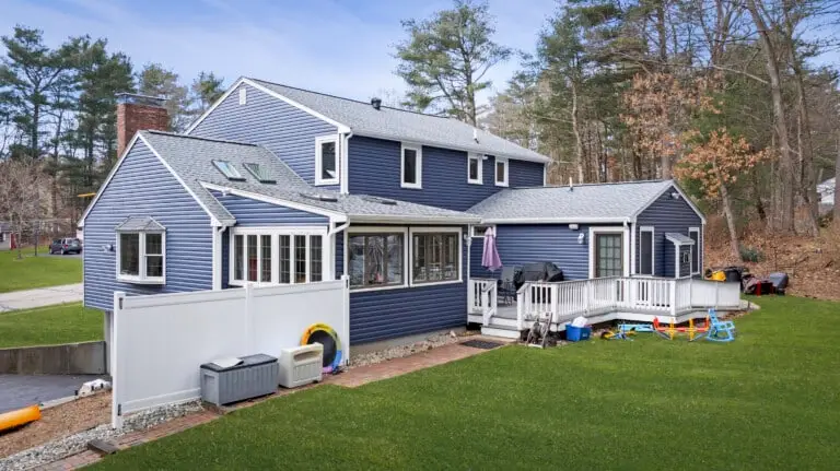House with exterior indigo vinyl Dutch lap siding