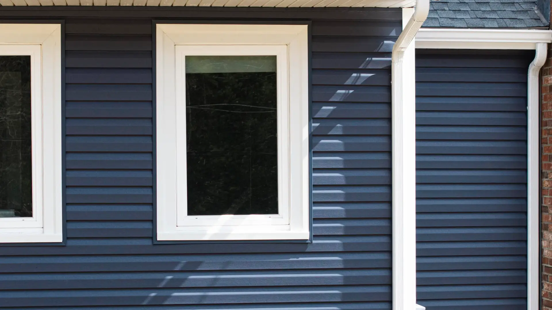 new blue siding from coastal windows on a home