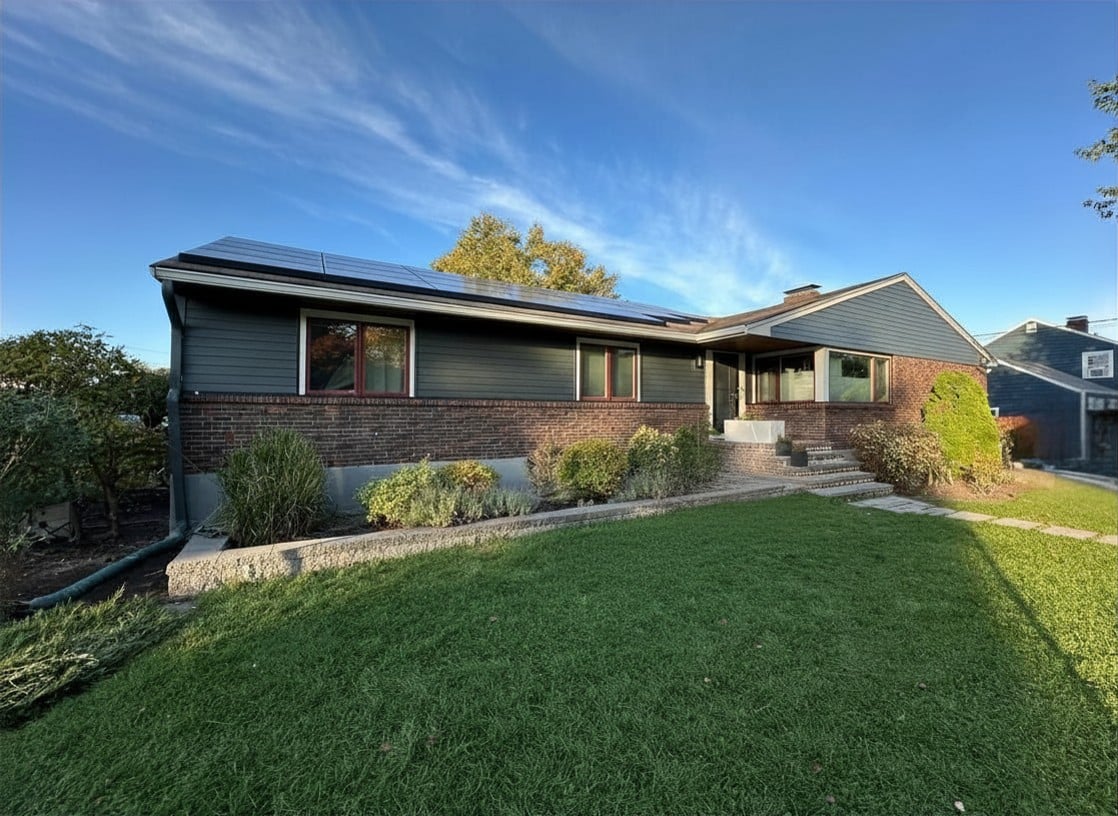 modern ranch home featuring iron gray from james hardie siding colors with brick exterior
