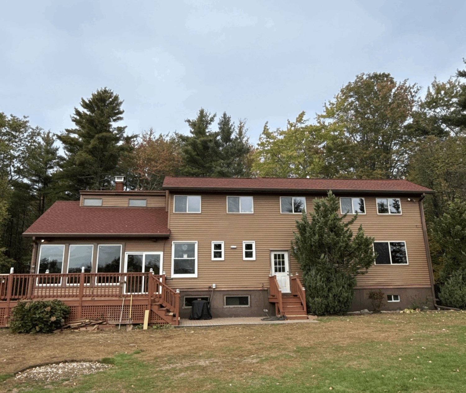 Beautiful New England home showcasing energy-efficient exterior upgrades recommended in fall home improvement guide