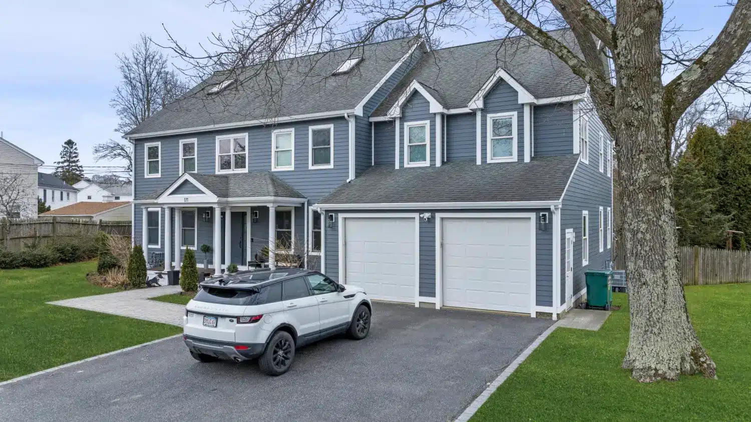Premium James Hardie CedarMill siding provides energy efficient siding performance while giving this bedford NH home a timeless gray exterior. The professionally installed fiber cement siding helps improve energy efficiency, weather resistance, and long-term durability.