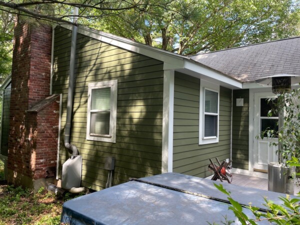 Beautiful exterior remodeling project by Coastal Windows & Exteriors transforming a New England home with new siding, roofing, and windows for stunning curb appeal