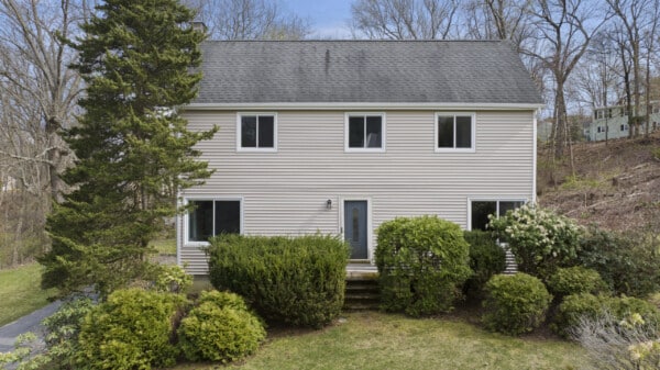 Vinyl siding installation in Ashland MA, Middlesex County, by Coastal Windows & Exteriors to enhance home curb appeal, energy efficiency, and weather protection