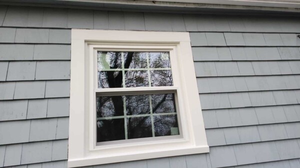 Double-hung energy-efficient replacement windows installed in Beverly MA, Essex County, by Coastal Windows & Exteriors to enhance comfort, curb appeal, and performance