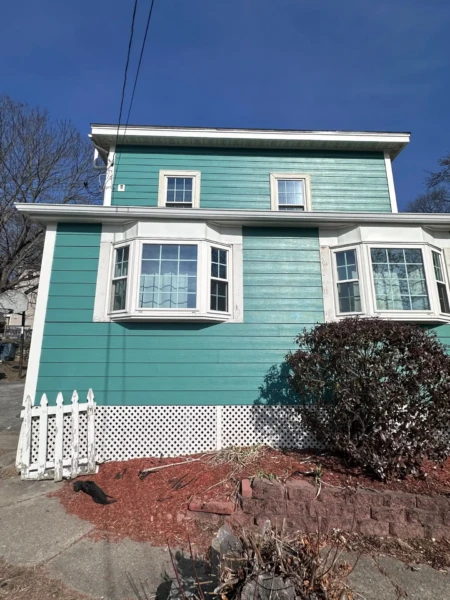 James Hardie siding in Santa Monica Pier color installed in Dracut MA, Middlesex County, by Coastal Windows & Exteriors for a durable, coastal-style home upgrade