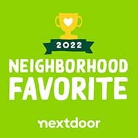 A green badge with a yellow trophy icon and a heart. Text reads 2022 Neighborhood Favorite and nextdoor.