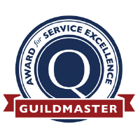 A circular emblem featuring a large Q in the center. Surrounding text reads Award for Service Excellence. A red banner at the bottom displays Guildmaster. The design integrates blue, white, and red colors.