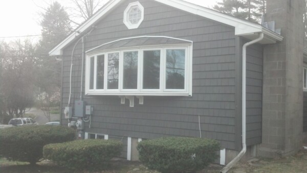 Low-maintenance siding installation transforms this home’s exterior with long-lasting, paint-free curb appeal