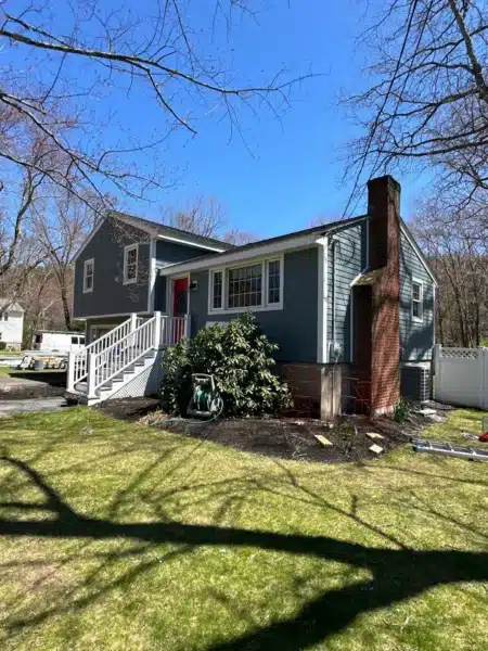 James Hardie Cedarmill siding in Boothbay Blue installed by Coastal Windows & Exteriors on a New England home for durable, low-maintenance coastal protection