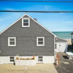 Maintenance-free exterior renovation in Marshfield MA, South Shore, featuring new siding, windows, and roofing by Coastal Windows & Exteriors