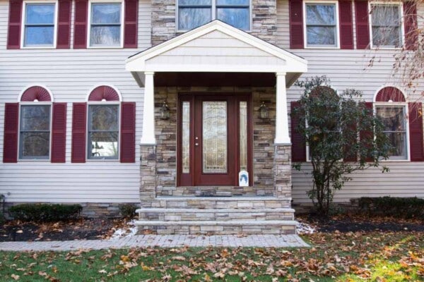 Entryway makeover in Massachusetts with ProVia door and Vytex windows installed by Coastal Windows & Exteriors for improved curb appeal, energy efficiency, and security