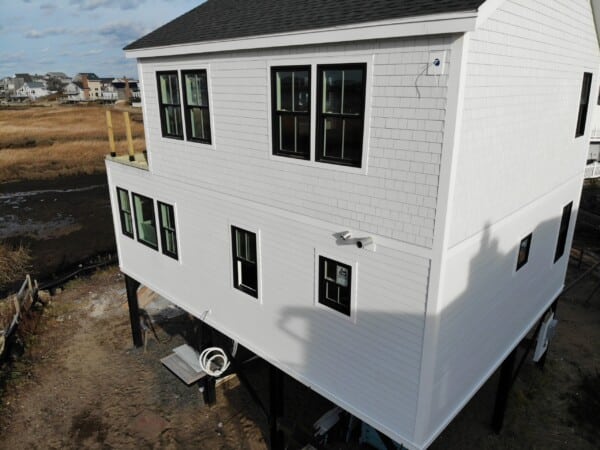 Moisture- and rot-resistant James Hardie siding installed by Coastal Windows & Exteriors on a New England home to improve durability, weather protection, and curb appeal