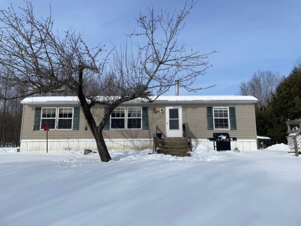 Driftwood-colored vinyl siding installed in Salem MA, Essex County, by Coastal Windows & Exteriors for a maintenance-free, weather-resistant North Shore home upgrade