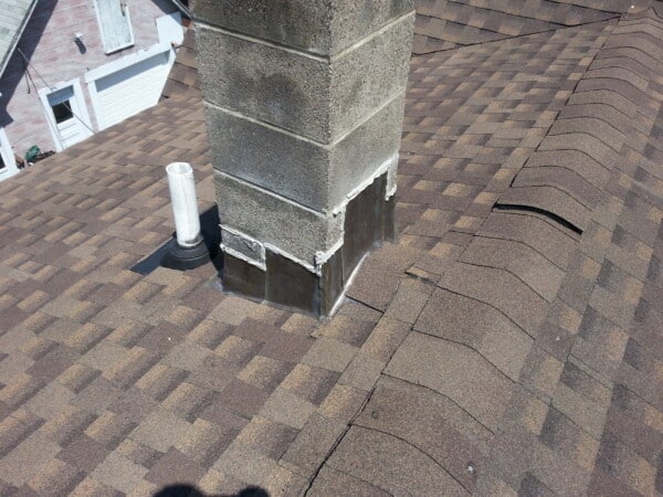 Shingle roof replacement project showcasing vibrant new shingles on a home transformed with quality and efficiency