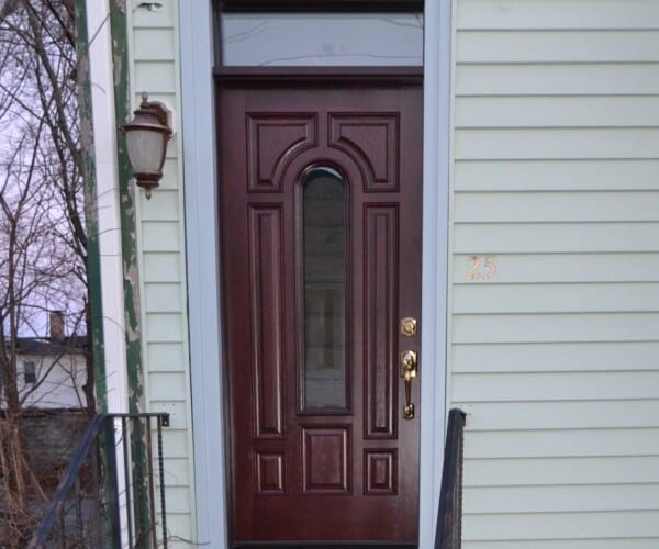 Stylish new entry door installed in Stoneham MA to eliminate drafts and stop pest intrusion while adding curb appeal