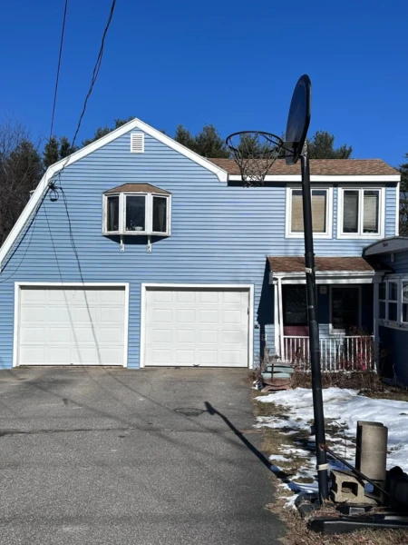 Window and vinyl siding installation in Stratham NH, Rockingham County, by Coastal Windows & Exteriors for a durable, low-maintenance, and energy-efficient home exterior