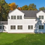 Classic farmhouse remodel in West Newbury MA, North Shore, featuring modern siding, windows, and roofing by Coastal Windows & Exteriors