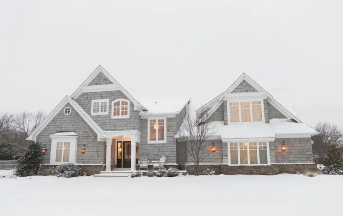 roof covered in snow and the impact of ice dams