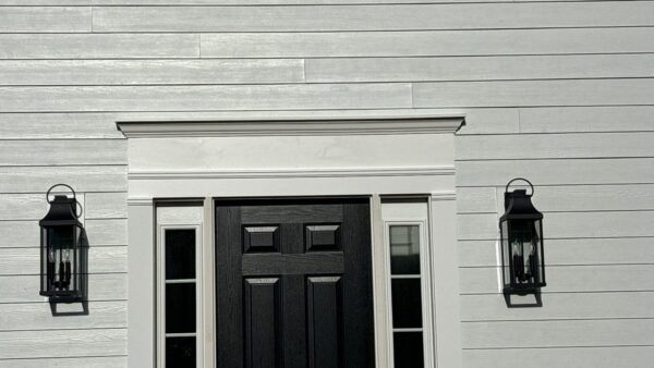 Fiberglass front door installation in Beverly MA, North Shore, Essex County, offering enhanced energy efficiency, security, and timeless curb appeal.