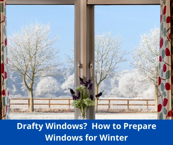 A scenic winter view reveals frost-covered trees and a wooden fence through a window. A vase with purple flowers sits on the windowsill. Text reads: Drafty Windows? Discover How to Prepare Your Home for Winter.