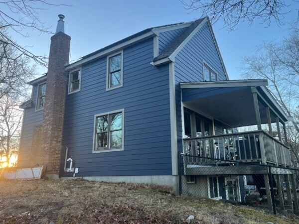 James Hardie siding installation in Plymouth MA, South Shore region, with fiber cement upgrade by Coastal Windows & Exteriors for enhanced curb appeal and weather protection