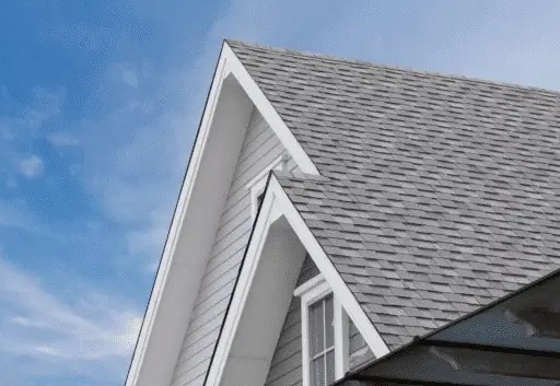 Shingles on a Newbury home featuring a badge highlighting a 50-year transferable warranty