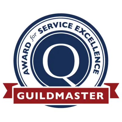 A circular emblem features a prominent letter Q at its center, symbolizing the GuildQuality Award for Service Excellence. Encircling it are those prestigious words, with a red ribbon beneath showcasing GUILDMASTER in crisp white letters.