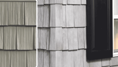 Close-up of a house exterior showing gray wooden shingles and a black-framed window to the right. Sunlight appears to be coming from the window, adding warmth to the scene.