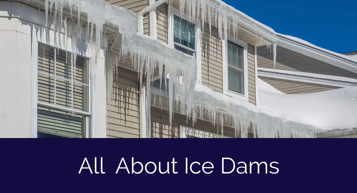 Close-up of a house roof with large icicles hanging from the eaves, under a clear blue sky. Text at the bottom reads, All About Ice Dams: Understanding the Icicles Silent Architects.