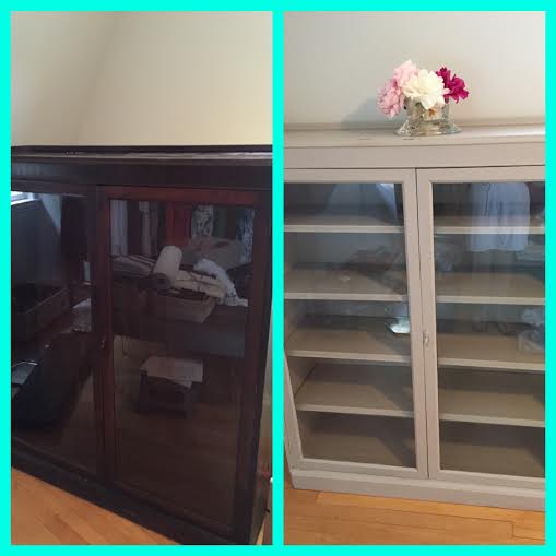 A side-by-side comparison showcases a vintage dark wooden cabinet on the left and a skillfully painted light gray cabinet on the right. The right cabinet, with its glass doors, flaunts a charming DIY paint makeover and is topped with a small vase of pink and white flowers.