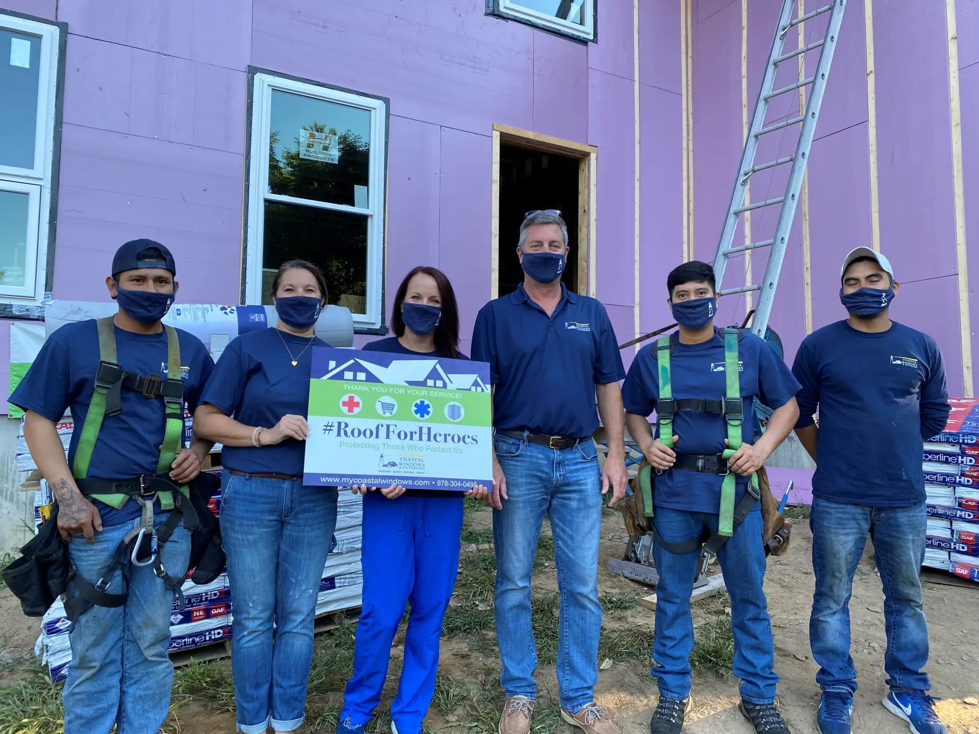 coastal windows and exteriors crew on job site