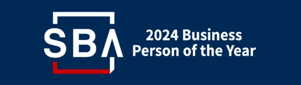 Logo with SBA in large letters enclosed in a square, featuring a red underline on the bottom left. To the right, against a dark blue background, the text reads 2024 Business Person of the Year, an accolade celebrated by Northshore Magazine.