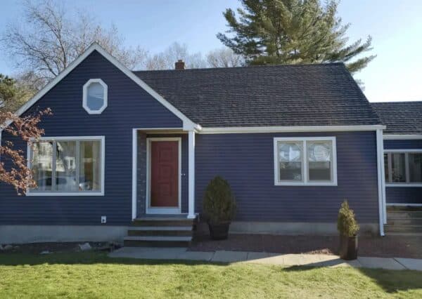 A blue house with a red front door