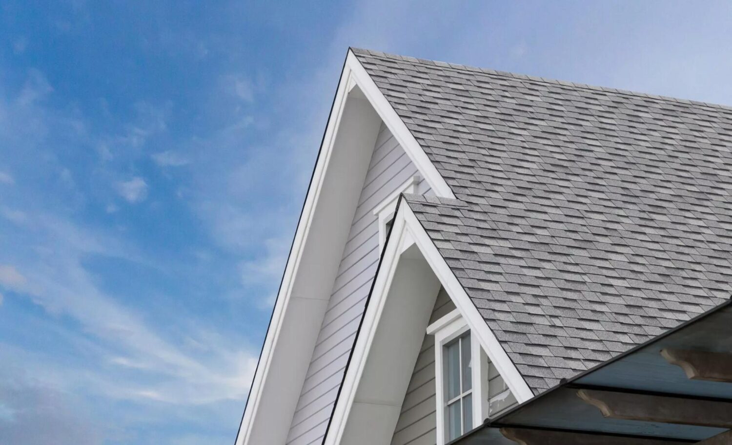 Light gray shingle roof on residential home in Littleton MA. roofing services, roofing contractor, roof replacement, roof repair, roofing company near me.