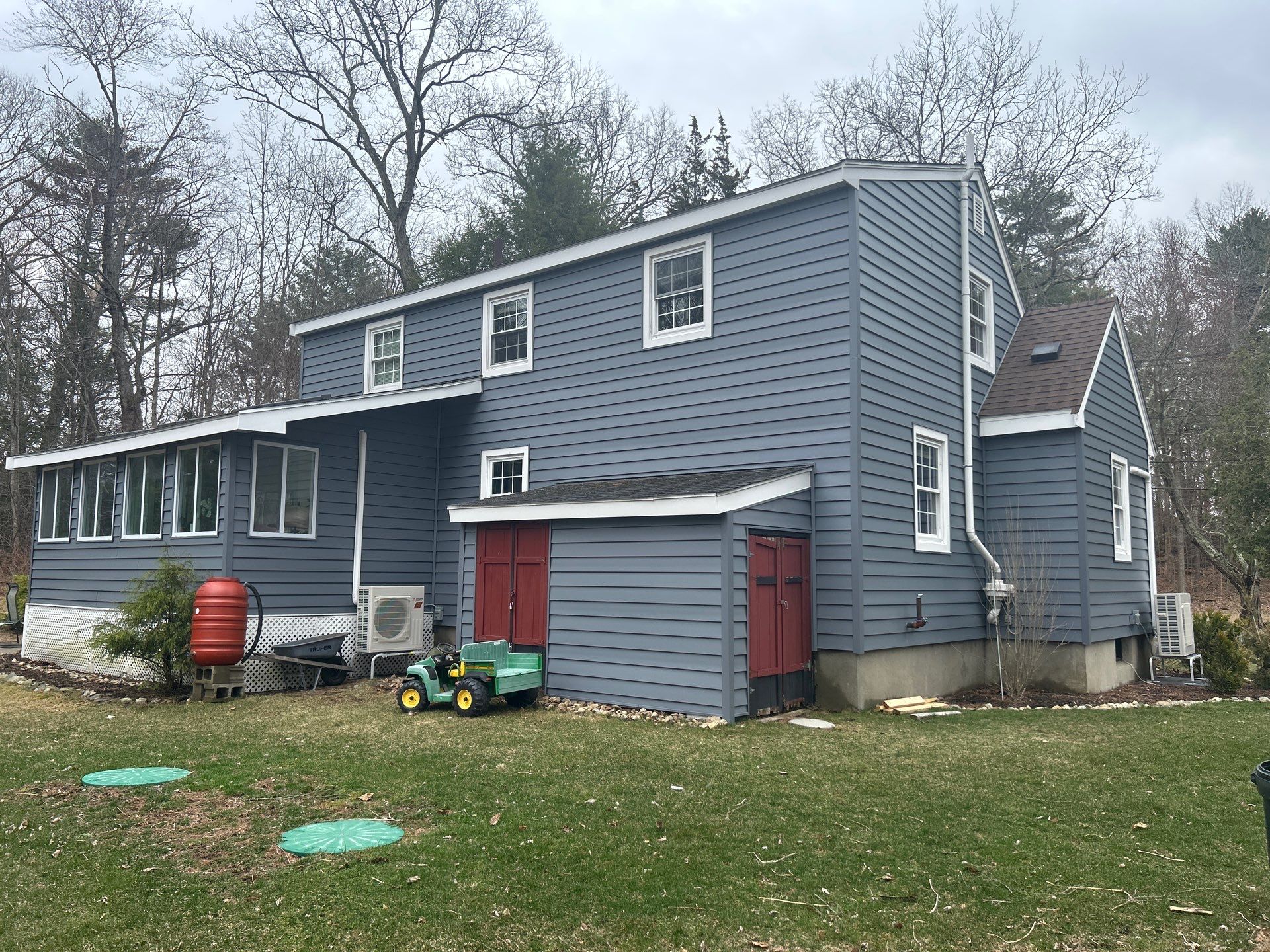 Low-maintenance vinyl siding installation in Massachusetts by Coastal Windows & Exteriors, featuring insulated siding designed for year-round durability.