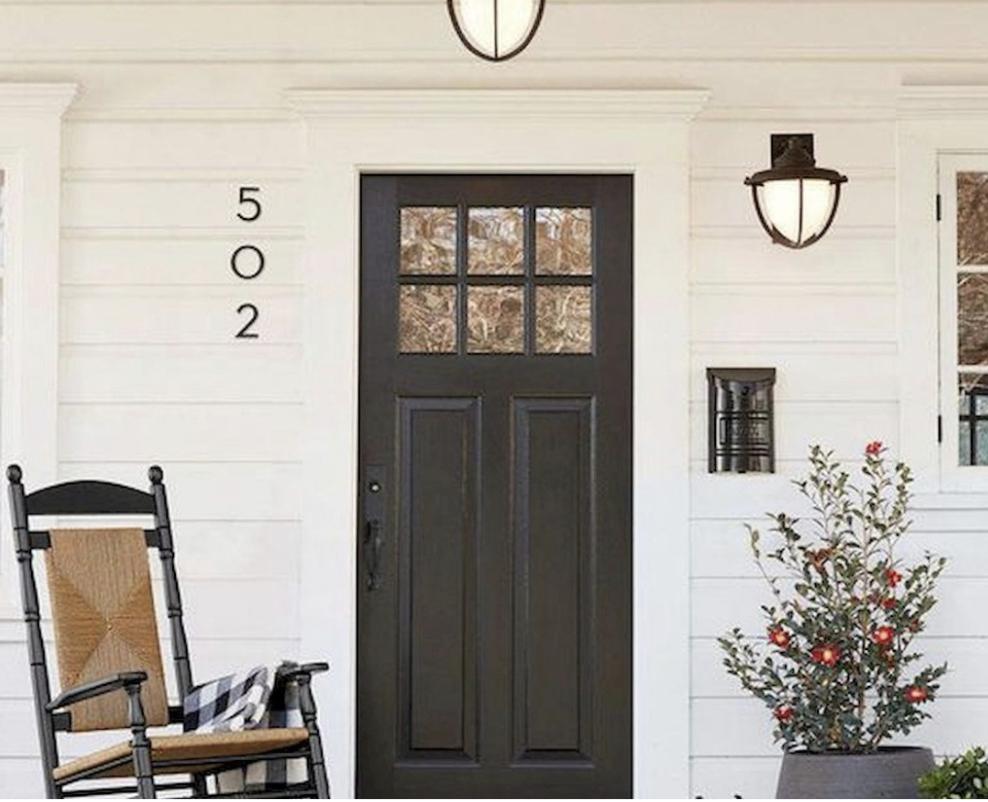 Black traditional entry door with glass panels in Sudbury MA home by Coastal Windows & Exteriors