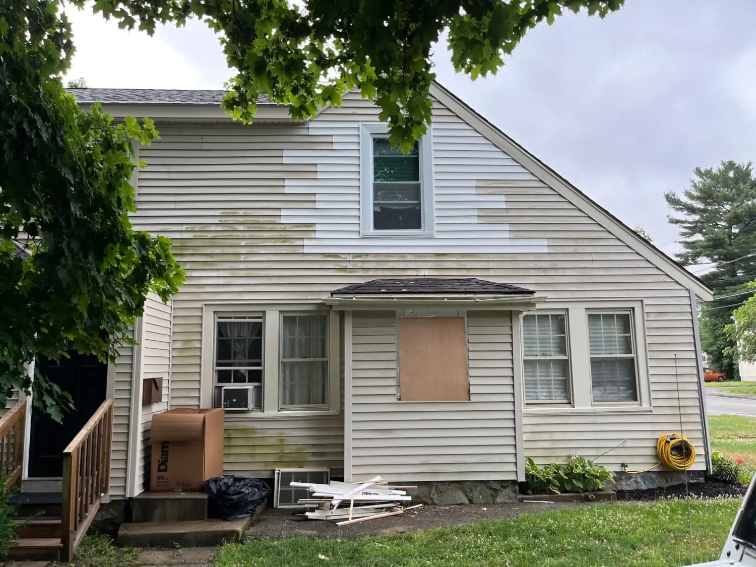 Mold and mildew growth on exterior siding identified during a siding inspection checklist as a sign of moisture intrusion and potential hidden damage.